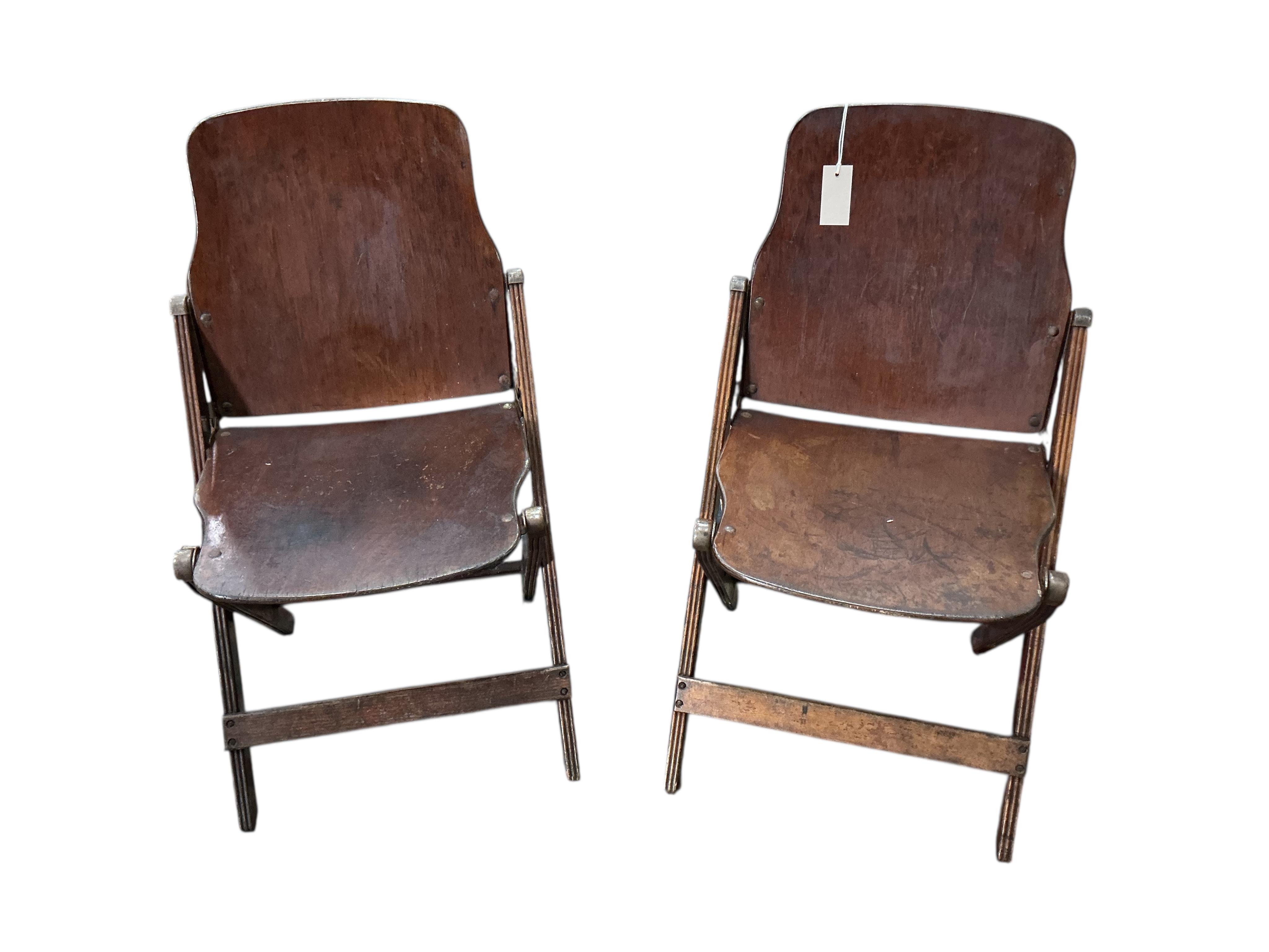 A pair of US administrative folding chairs, India, width 43cm, depth 39cm, height 76cm